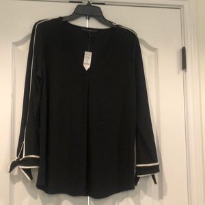 Black shirt with white trim